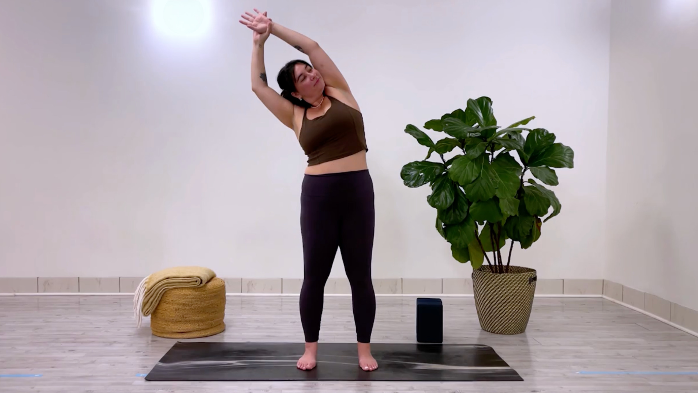 Yoga teacher Taylor Lorenz in Standing Side Bend